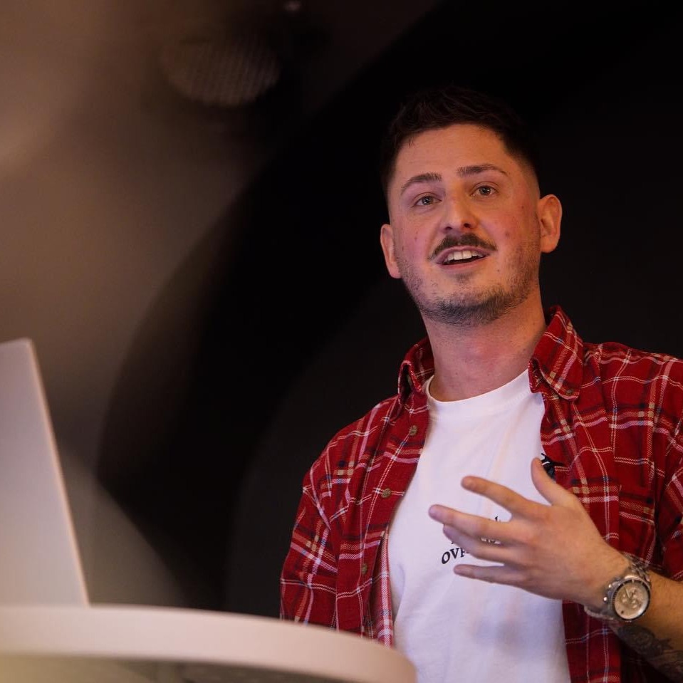 Vito Veselinović presenting on stage