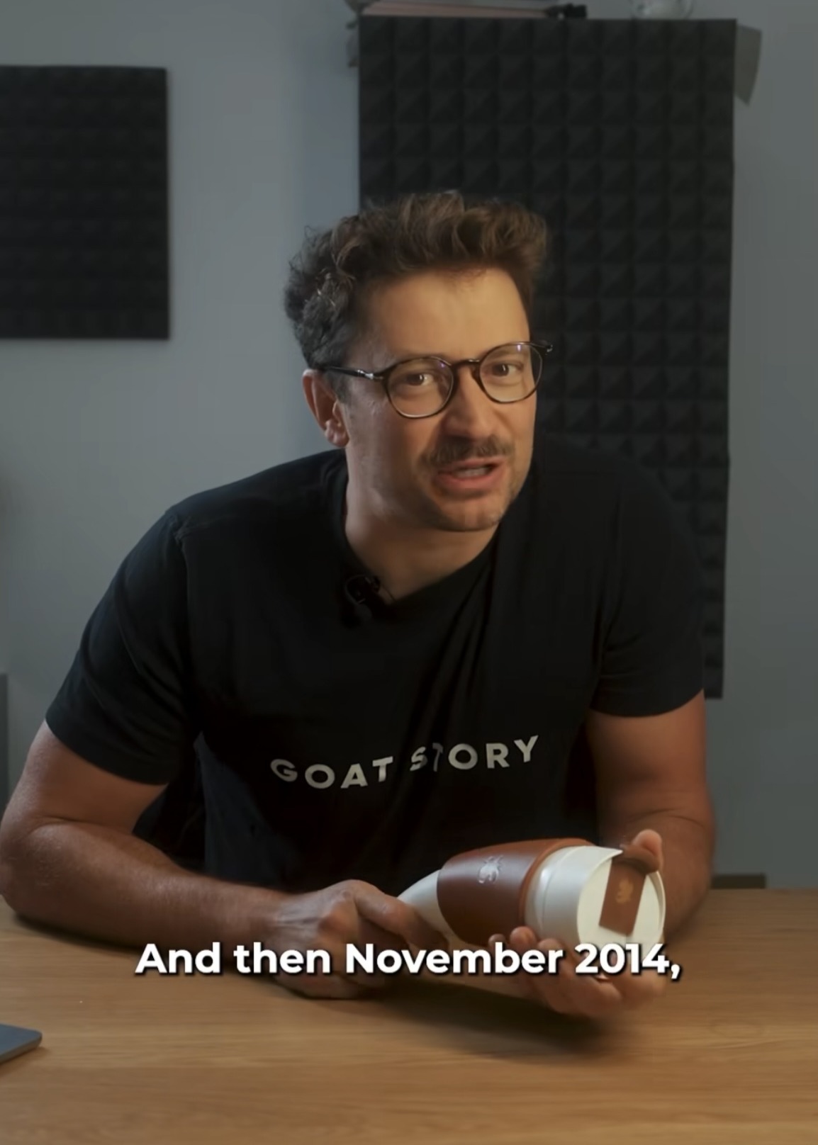 Anže Miklavec in a GOAT STORY shirt holding the GOAT Mug, from the 10-year anniversary video series